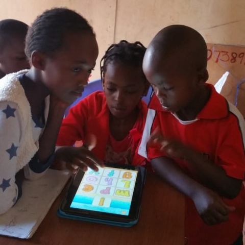 children learning via a tablet